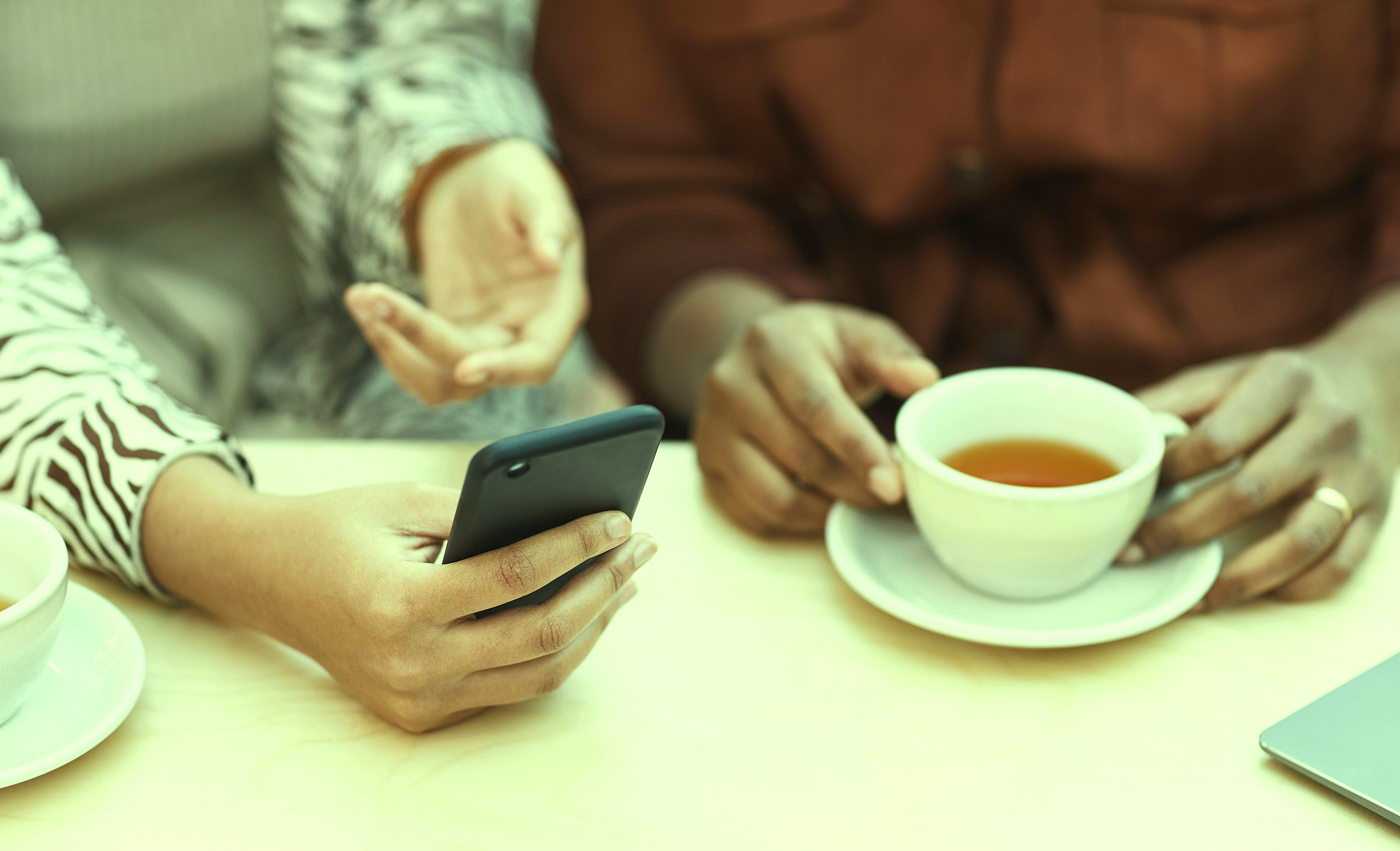 Two people having a cofee together